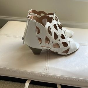 White ankle bootie heels with cutouts